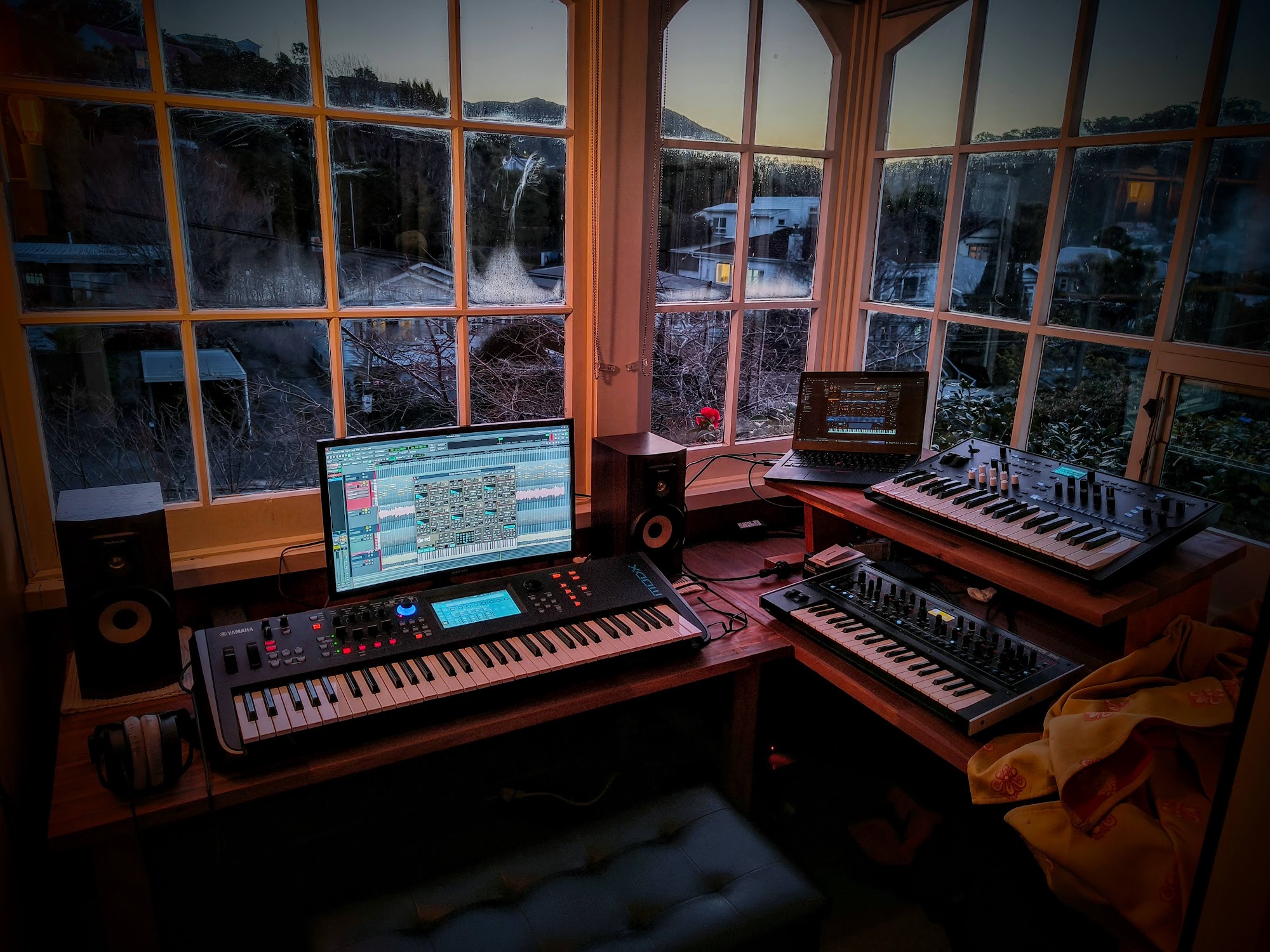 The studio with custom-built desks and synthesizers